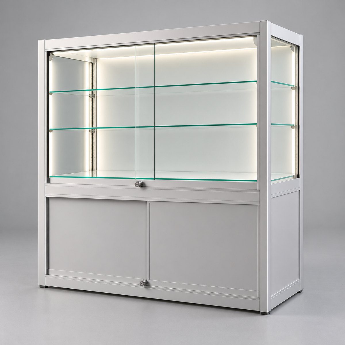 Silver glass display counter with lockable storage base, 1200 x 500 x 1100mm, two LED lit glass shelves